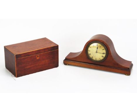 An Edwardian mahogany mantel timepiece of arched outline, with 9cm Roman dial, raised on squat gilt feet, 30.5cm wide, togeth