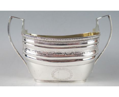 A 19th century silver twin handled sugar basin, all marks worn and illegible, initialled, of barge-shaped outline, with bande