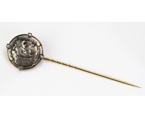 An Unmarked Precious Yellow Metal, Rose Cut Diamond Stick Pin set with a Greek? silver coin, 6.52g 