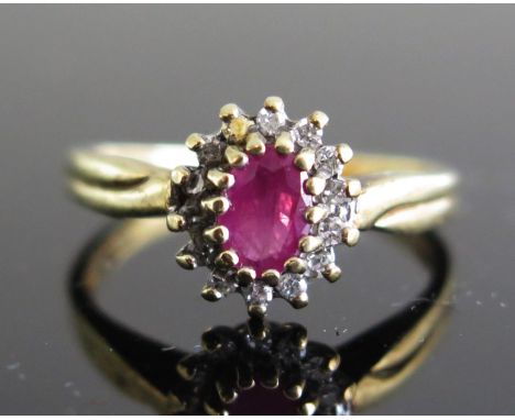 A 9ct Gold, Ruby and Diamond Cluster Ring, .15PTS, continental marks, size N.5, 2.52g 