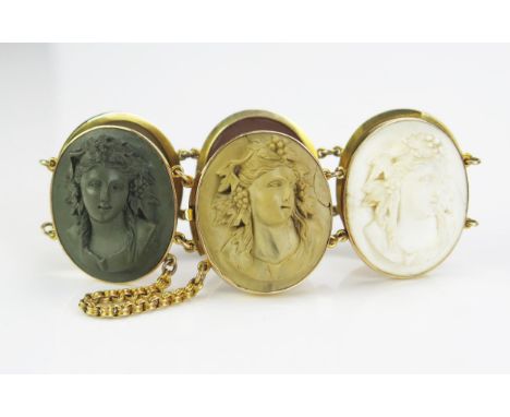 A Large Antique Cameo Lava Bracelet in a precious yellow metal setting, the six 35x30mm high relief panels decorated with the