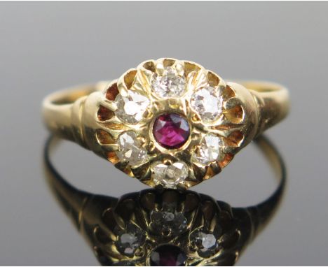 An Antique 18ct Gold, Ruby and Diamond Cluster Ring, 10mm head, rubbed hallmarks, size Q.75, 3.06g. Presented in a period box