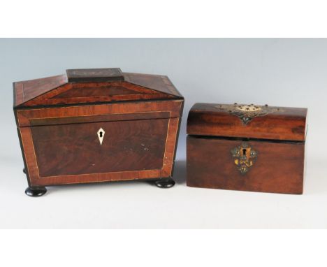 A Victorian walnut and brass mounted tea caddy, the domed hinged lid enclosing two lidded compartments, 21cm wide together wi