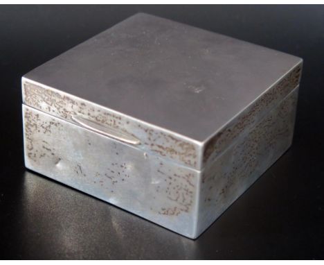 An Elizabeth II silver cigarette box, maker William Neale &amp; Son Ltd, Birmingham, 1952, of square outline with engine turn