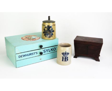 A 19th century mahogany and satinwood beaded tea caddy of sarcophagus outline, the hinged lid enclosing two lidded compartmen