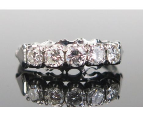 A Platinum and Diamond Five Stone Ring, the brilliant round cuts measuring c. 3.3, 2x 3.3.1 and 2x3mm, stamped PLAT, size K.5