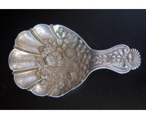 A Victorian silver caddy spoon, maker Joseph Willmore, Birmingham, 1839, the shell-shaped bowl with embossed floral decoratio