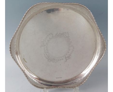 An Edward VII silver circular serving dish, maker Atkin Brothers, Sheffield, 1908, with wavy bobbin turned edge, with central