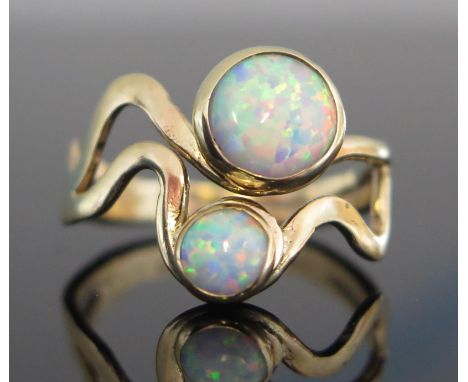 A 9ct Gold and Opal Ring, 7.2mm largest stone, hallmarked, size O, 3.12g 