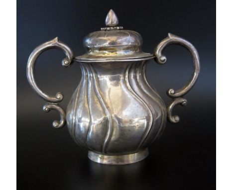 A Chinese silver twin handled sucriere and cover, stamped marks, with domed lift-off lid, of baluster writhen form, with doub