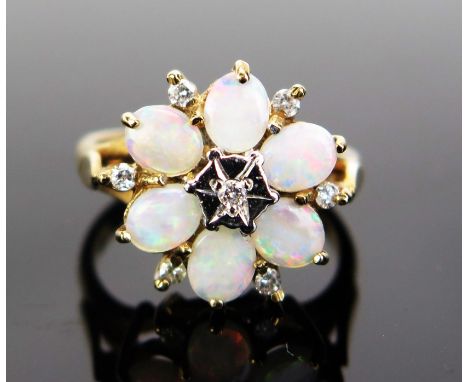 A 9ct Gold, Opal and Diamond Cluster Ring, 16mm head, hallmarked, 4.17g 