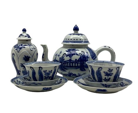 Pair of Chinese blue and white Kangxi tea bowls and saucers decorated with seated and standing figures, two further plates pa