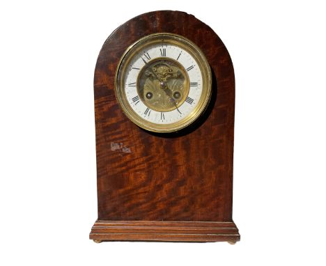 French - 8-day mantle clock in mahogany case circa 1900, with a round top and moulded plinth raised on ball feet, two-part di