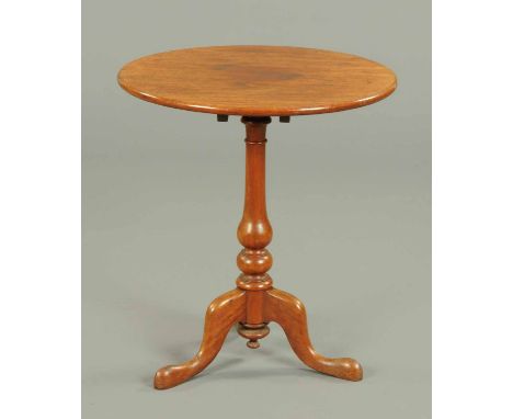 A Victorian fruitwood tripod table, with turned centre column and three downswept legs terminating in pad feet.  Diameter 26 