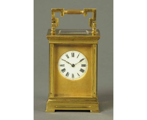 A large French brass carriage clock, with two-train movement, Anglaise case and brass surround to dial.  Height 5.75 ins excl
