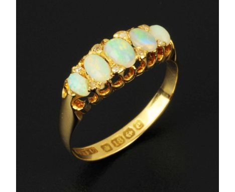 An 18 ct gold opal and diamond ring, size P.  CONDITION REPORT: The ring has a generally very good appearance. The stones hav