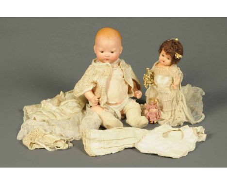 Three bisque headed dolls, Armand Marseilles, Heubach-Koppelsdorf and one miniature.  CONDITION REPORT: The body of the doll 