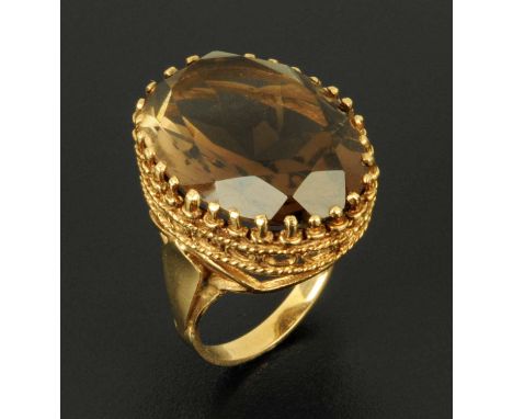 A 9 ct yellow gold ring, with fancy mount, citrine, 27 mm x 22 mm, size O/P.  CONDITION REPORT: The hallmark is a little diff