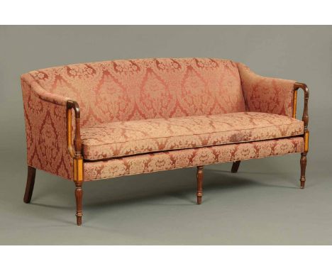 A Regency style mahogany framed sofa, with stuffover back and squab cushion upholstered in foliate patterned material, with c