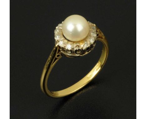 An 18 ct gold diamond and pearl ring, size N/O.