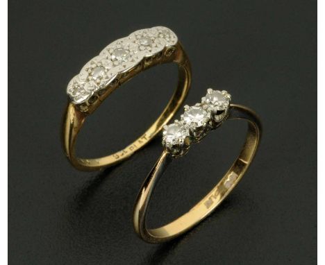 An 18 ct gold and platinum three stone diamond ring, and a 9 ct gold and platinum five stone diamond ring, sizes N and K resp