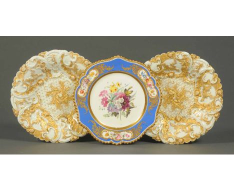 A Chamberlains Worcester plate, handpainted with a floral spray and two Continental porcelain relief moulded plates decorated