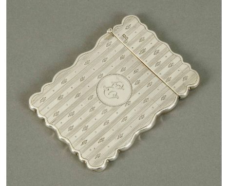 An Edwardian silver visiting card case, engine turned and engraved, Chester 1909, 65 grams (see illustration).
  