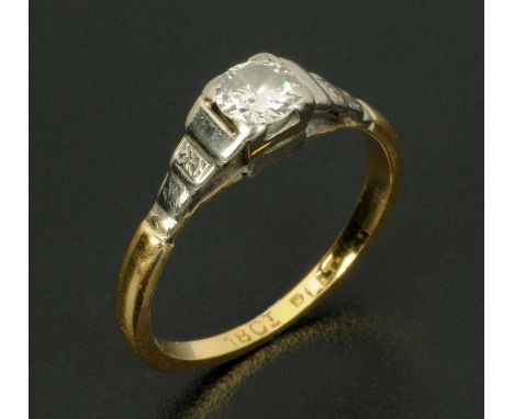 An 18 ct gold diamond and platinum solitaire ring, size K. CONDITION REPORT: The diameter of the stone is approx 4.5 mm.  The