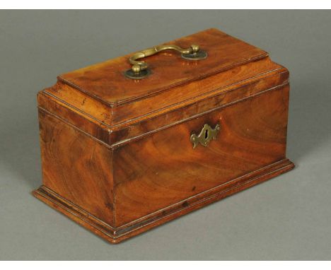 A George III mahogany tea caddy, with brass carrying handle and lock escutcheon and with three interior compartments.  Width 