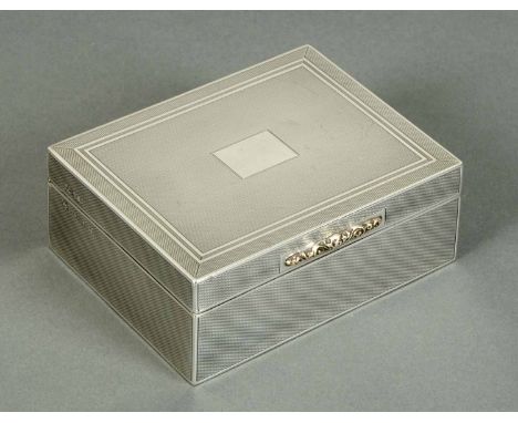 A silver cigarette box, engine turned, London 1930.  Width 4.5 ins (see illustration).
  CONDITION REPORT: The hallmarks are 