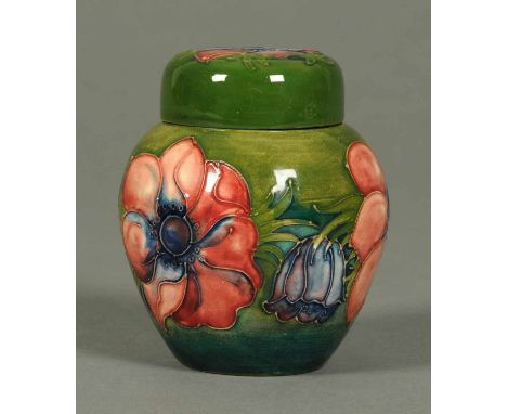 A Moorcroft ginger jar, Anemone pattern to green ground, paper label "Potter to The Late Queen Mary".  Height 4.75 ins.  COND