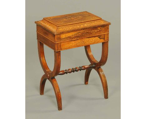 A Victorian rosewood worktable, with caddy top and frieze drawer and raised on Klismos type supports with turned centre stret