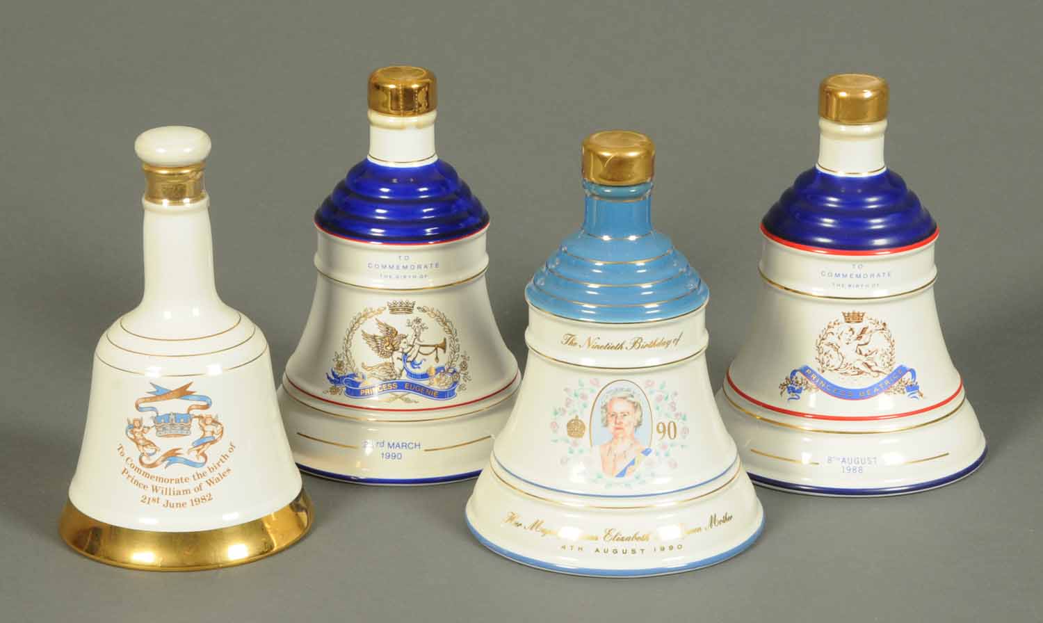 A collection of four Wade porcelain commemorative Bells Scotch Whisky