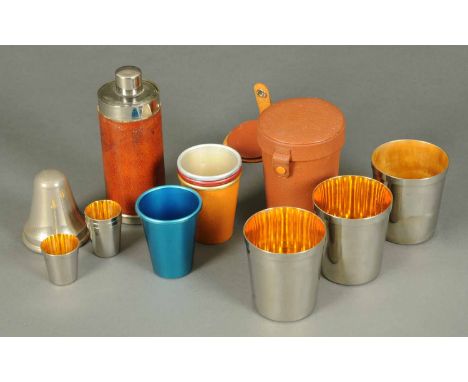 A collection of hunting drinking accessories, four plated mugs in leather case, four aluminium tumblers and silver and leathe