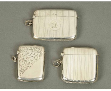 Three silver Vesta cases, two engine turned both Birmingham 1912 and one foliate engraved, Birmingham 1908 (see illustration)