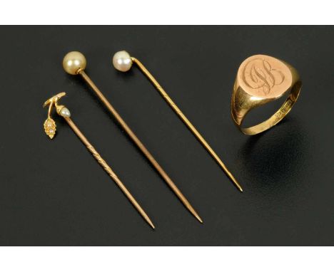 A 9 ct gold signet ring, 3.3 grams, size S, and three stick pins, one acorn and oak leaf set with pearls and two others.  