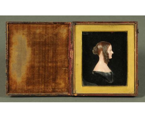 A wax profile portrait of a female figure, late 19th century, cased.  5.5 ins x 5 ins. CONDITION REPORT: The outer leather bo