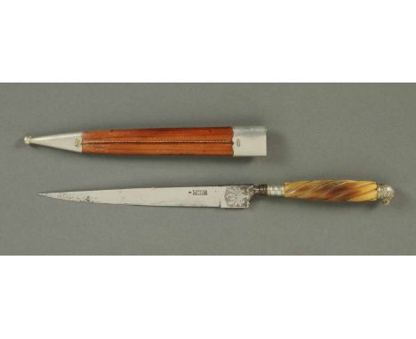 An antique gaucho knife, with leather scabbard, parrot head terminal and bone handle, blade marked "F. Herder, Solingen".  Le