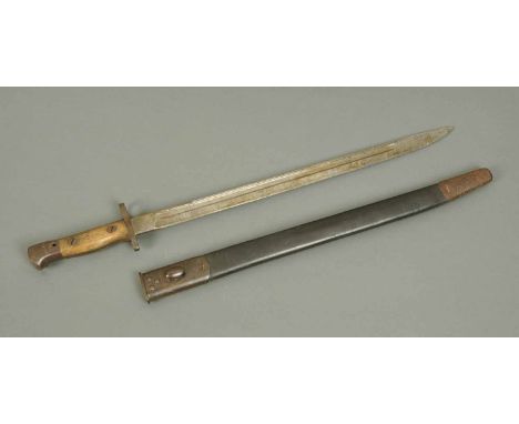 A First World War German bayonet, with leather and metal scabbard, wooden handle.  Length 22.5 ins. 