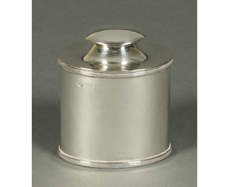 A George V silver tea caddy, oval and with spoon to underside of lid, Birmingham 1931,178 grams.  Width 3.25 ins (see illustr