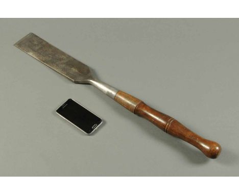 A large Victorian chisel, by Buck Brothers, cast steel.  Length 29 ins. 