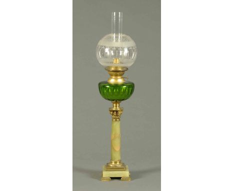 A Victorian oil lamp, with onyx column, brass capital, green reservoir and etched glass shade.  Height including chimney 25.5