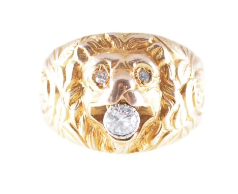 A lady's/gentleman's lion design dress ring, the yellow metal ring carved with the mask of a lion with an old brilliant cut d