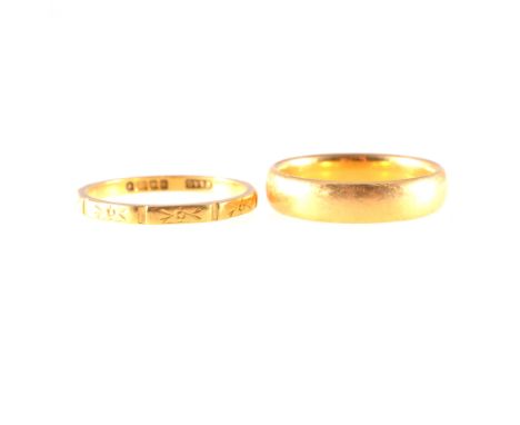 Two 22 carat yellow gold wedding bands, a 4.5mm wide plain polished D shape, ring size M, a 2mm wide finely engraved ring siz