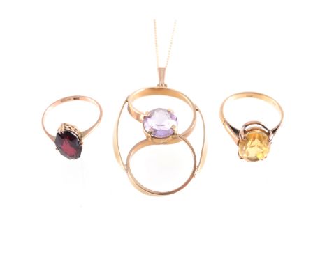 Two dress rings and a pendant, two dress rings both stamped 9ct, one set with an oval mixed cut citrine 12.5mm x 9mm, ring si