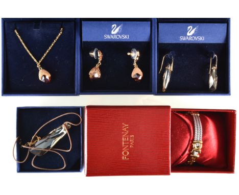 A Swarovski Crystal matching copper tone crystal pendant and matching earrings, a faceted crystal drop pendant 50mm long and 