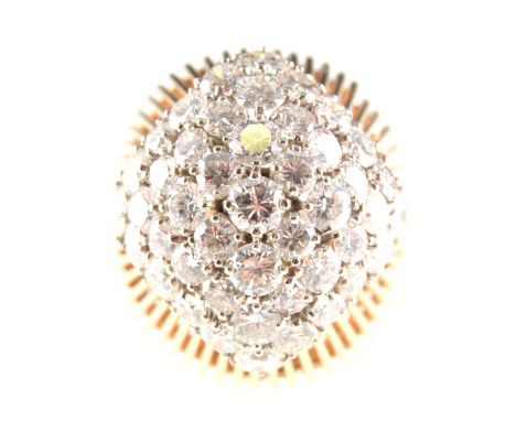 A diamond set cocktail ring, forty-four brilliant cut diamonds individually claw set on an all yellow gold domed shape mount 