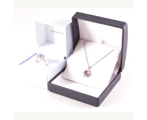 A modern amethyst and diamond pendant and ring suite, the round cabochon cut amethyst set in 9 carat white gold hexagonal mou