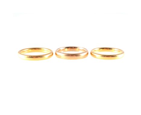 Three 22 carat yellow gold wedding bands, 3m and 3,5mm wide, plain polished finish, ring sizes M(1) and P(2), total weight ap