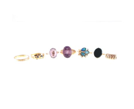 Seven dress rings, two amethyst dress rings, a modern opal triplet ring, a Victorian style ring set with two sapphires, a 9 c